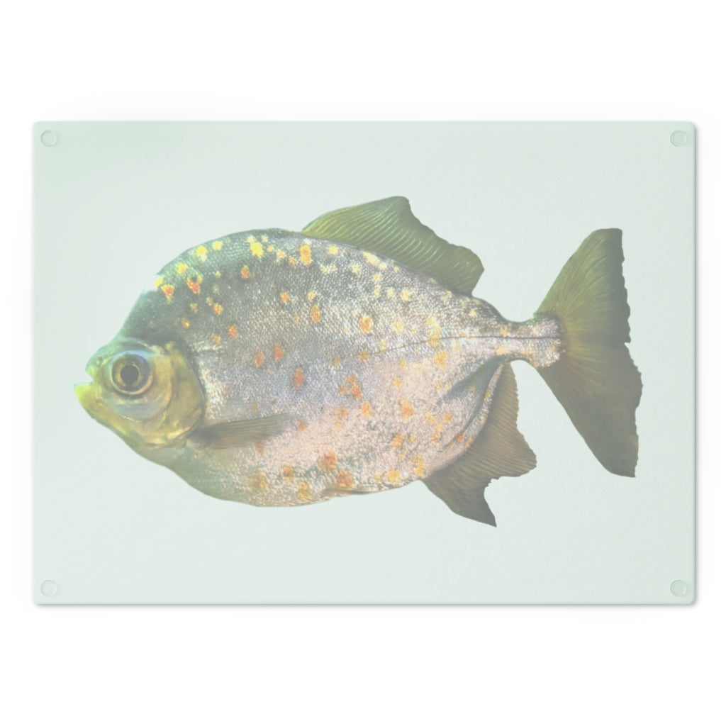 A stylish Fish with Specs Cutting Board made of tempered glass, featuring a unique fish design and four rubber dots for stability.