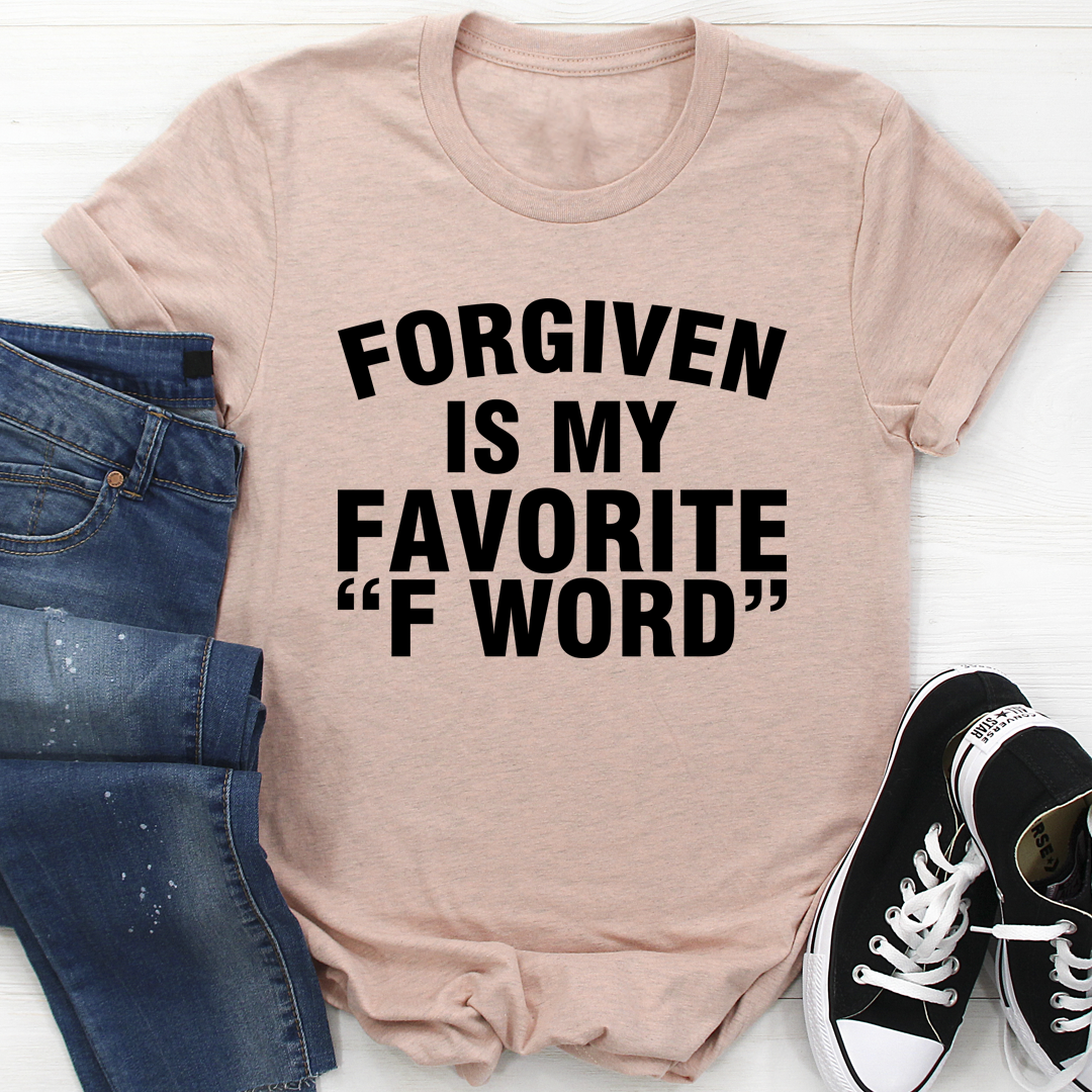 A stylish black t-shirt featuring the phrase 'Forgiven Is My Favorite F Word' printed in bold letters, showcasing its soft fabric and durable stitching.