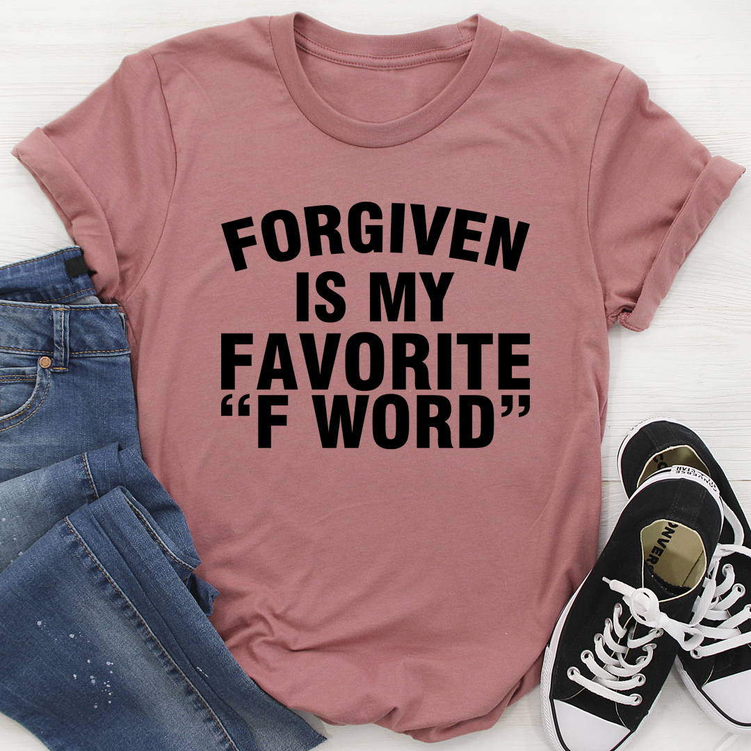 A stylish black t-shirt featuring the phrase 'Forgiven Is My Favorite F Word' printed in bold letters, showcasing its soft fabric and durable stitching.