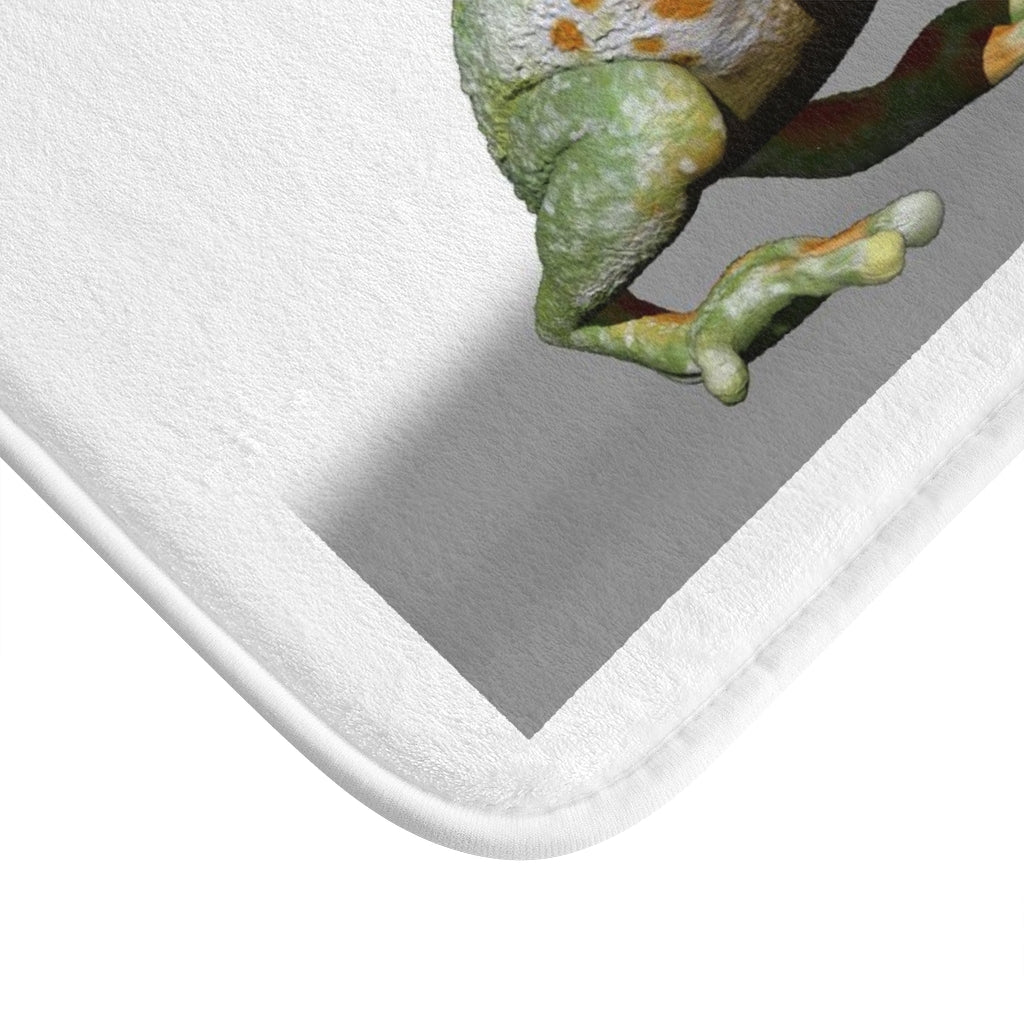 A colorful frog bath mat with anti-slip backing, featuring a playful frog design, perfect for bathroom decor.