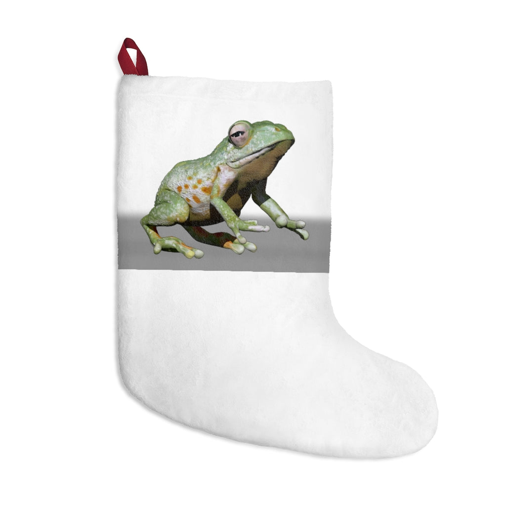 Personalized Frog Christmas Stockings hanging by a fireplace, featuring festive designs and a twill ribbon loop.