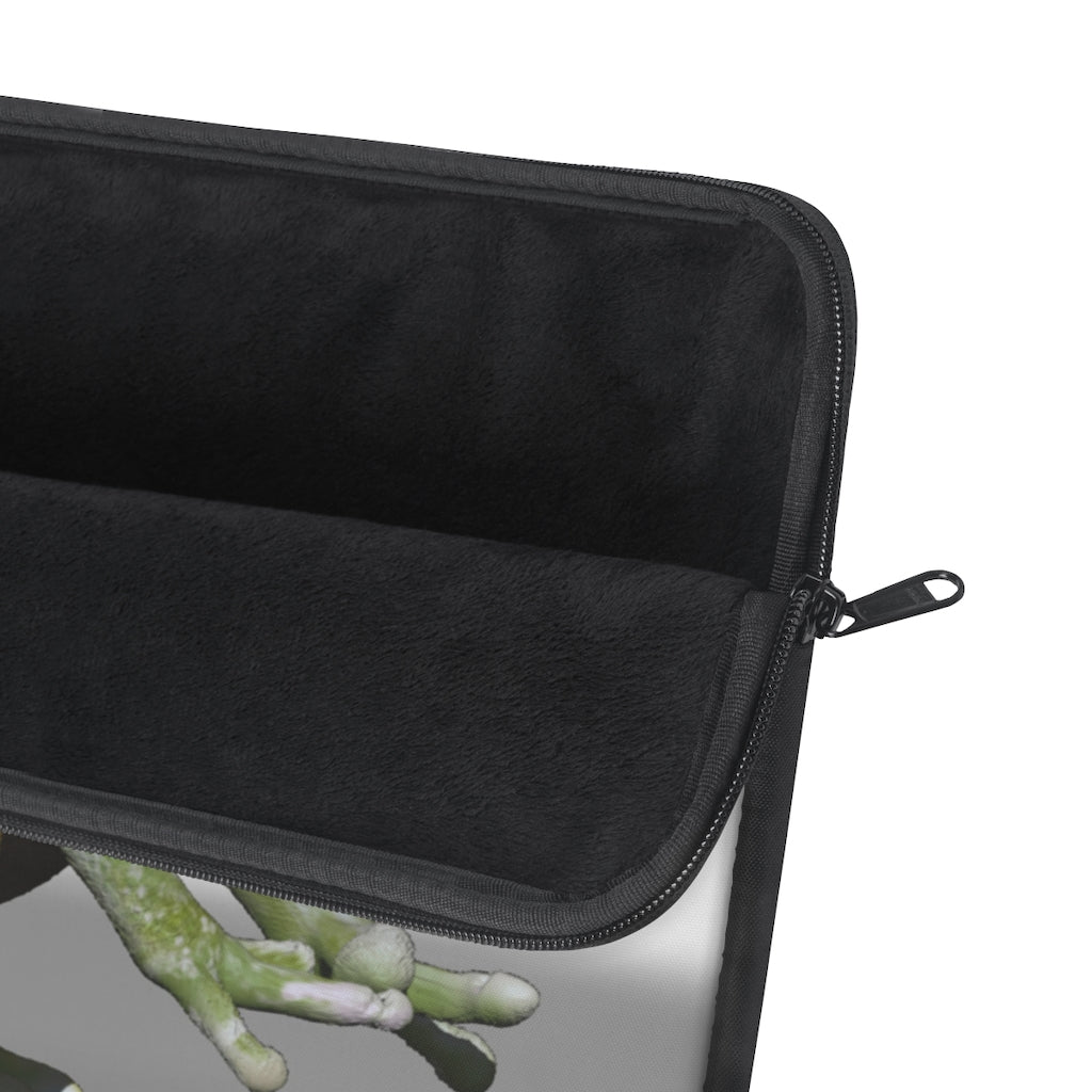 Frog Laptop Sleeve featuring a vibrant frog design on one side and a sleek black backside, perfect for protecting your laptop.