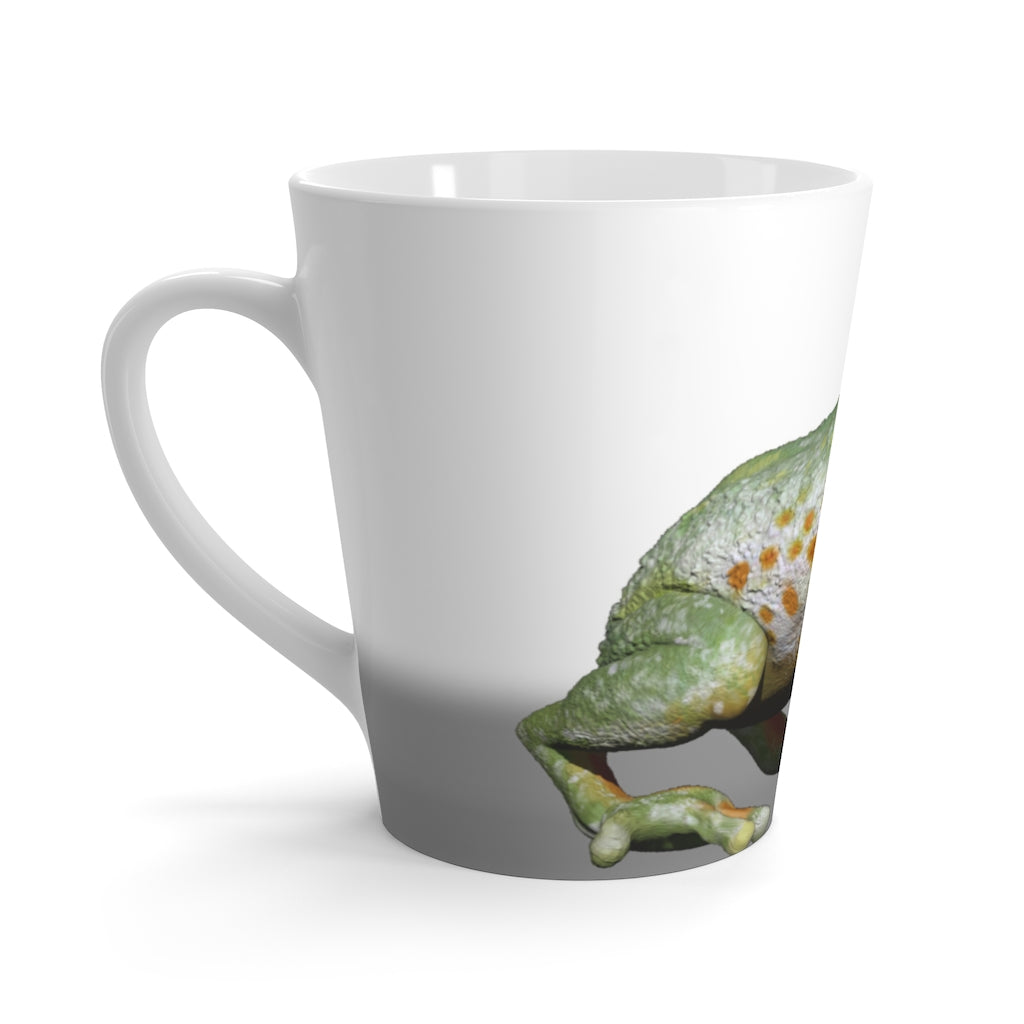 A charming white ceramic latte mug featuring a colorful frog design, perfect for coffee lovers.