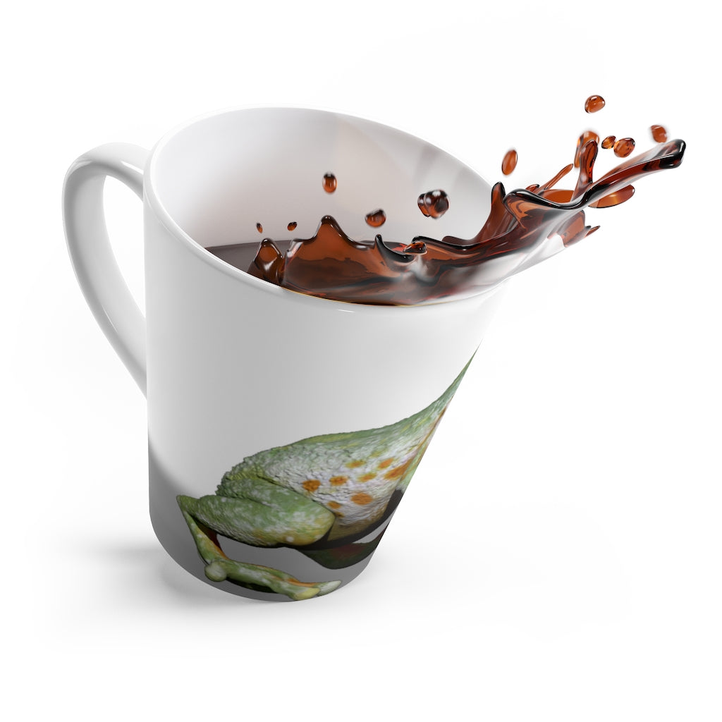 A charming white ceramic latte mug featuring a colorful frog design, perfect for coffee lovers.