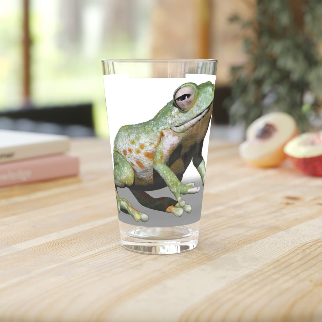 A clear 16oz Frog Pint Glass showcasing a customizable design, perfect for beverages.