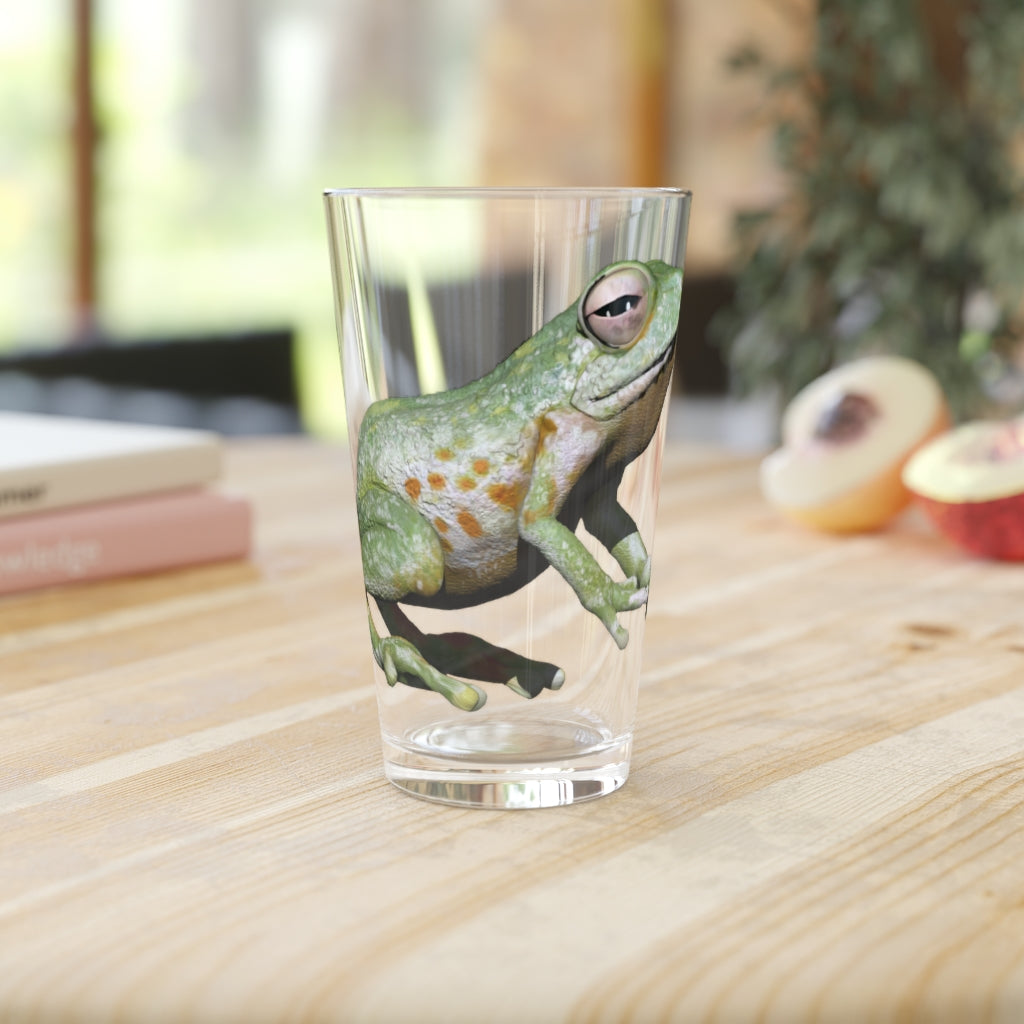 A clear 16oz Frog Pint Glass showcasing a customizable design, perfect for beverages.