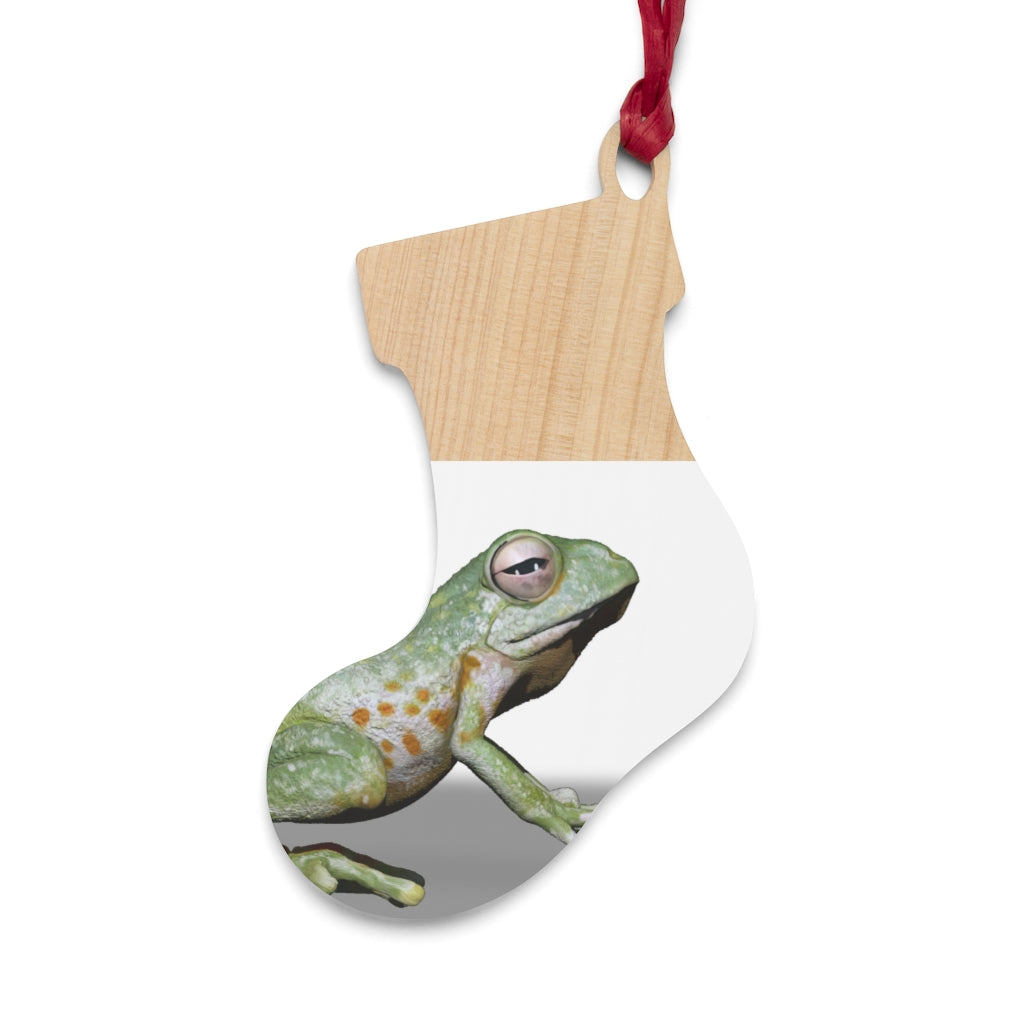 A collection of Frog Wooden Christmas Ornaments in various whimsical shapes, featuring a rustic wood finish and red ribbons for hanging.