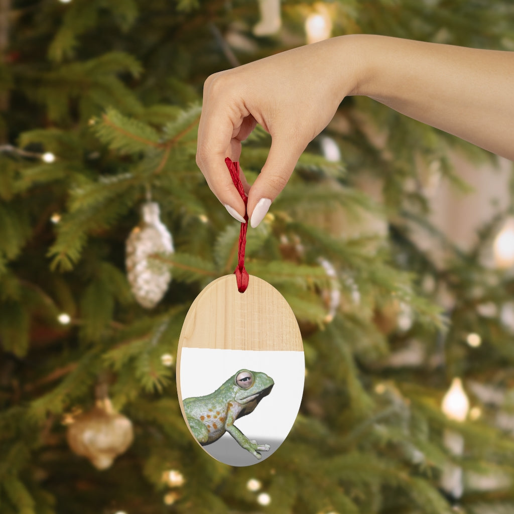 A collection of Frog Wooden Christmas Ornaments in various whimsical shapes, featuring a rustic wood finish and red ribbons for hanging.