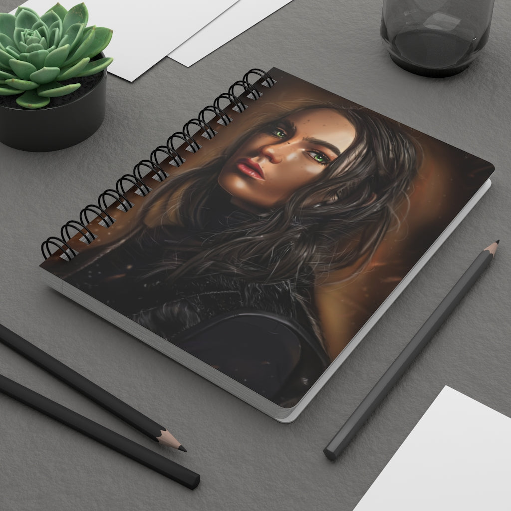 A stylish girl spiral bound journal with a glossy laminated cover, featuring colorful designs and lined pages for writing.