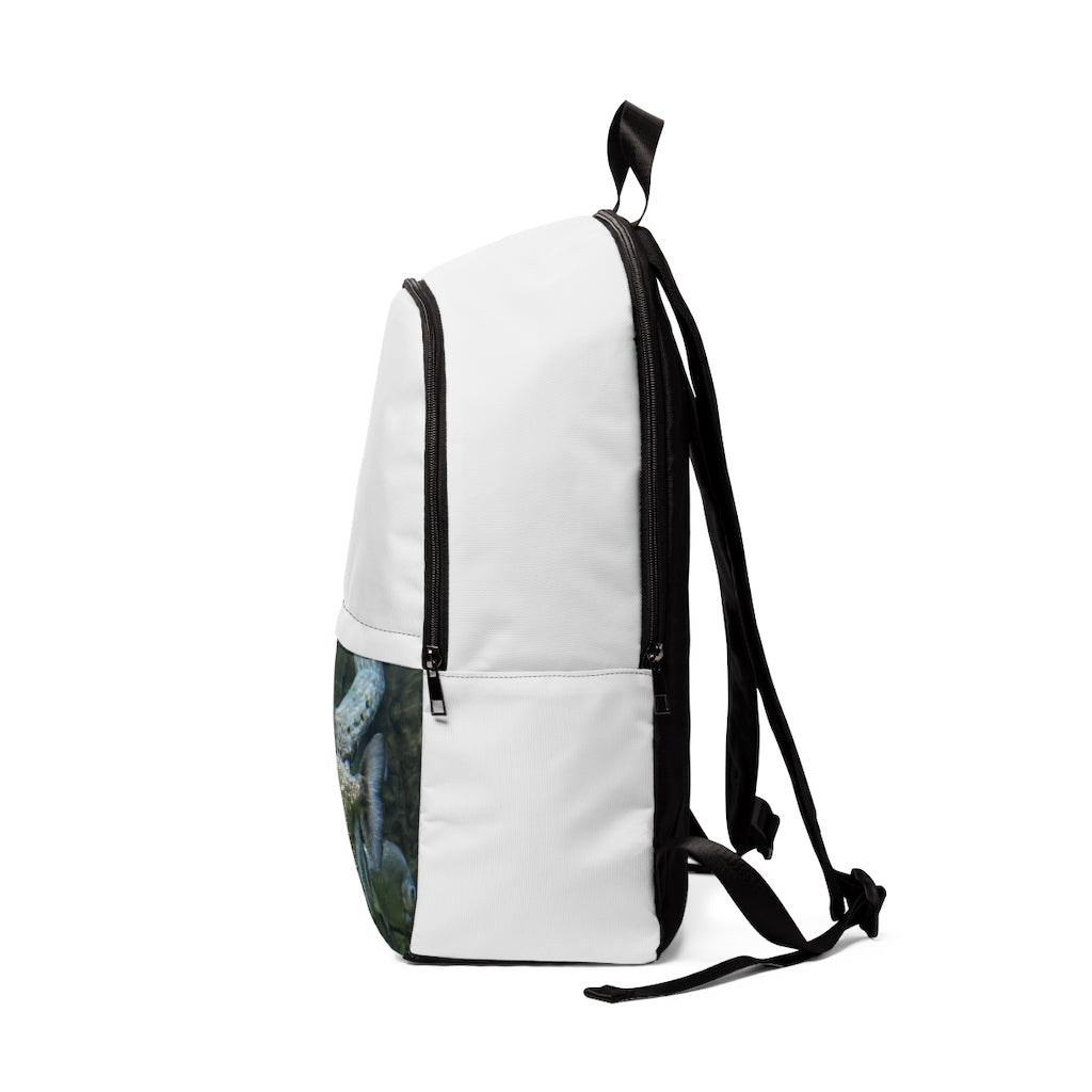 Glitter Green Fish Unisex Fabric Backpack showcasing a stylish design with adjustable straps and a padded back panel, perfect for school and travel.