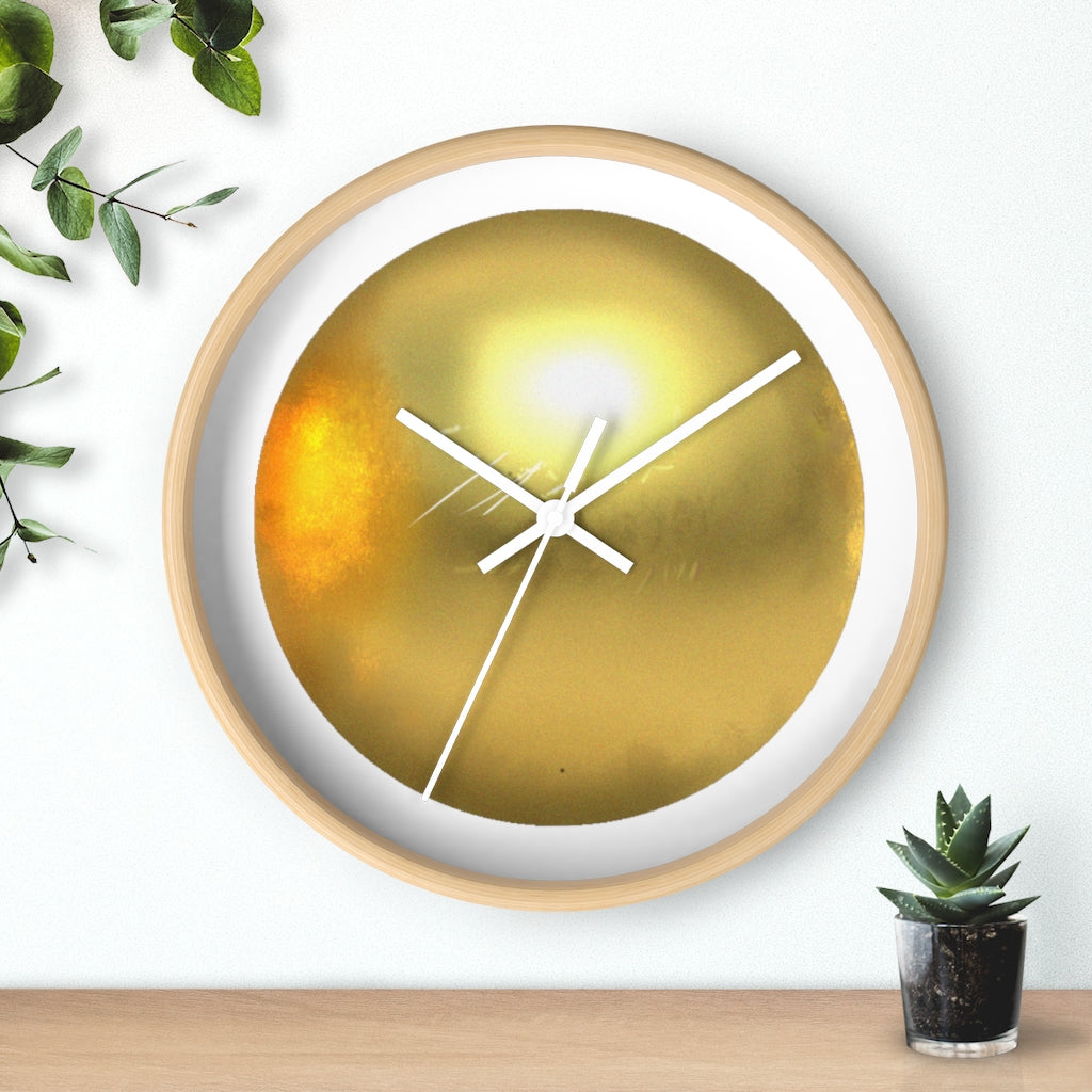 Elegant gold wall clock with wooden frame and plexiglass face, perfect for indoor decor.