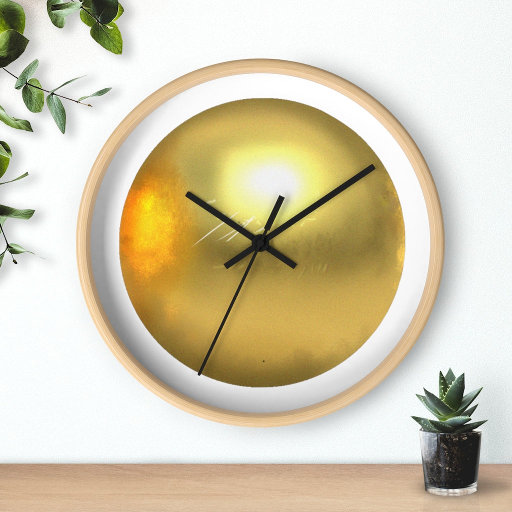 Elegant gold wall clock with wooden frame and plexiglass face, perfect for indoor decor.