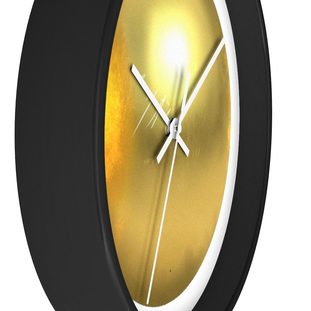 Elegant gold wall clock with wooden frame and plexiglass face, perfect for indoor decor.