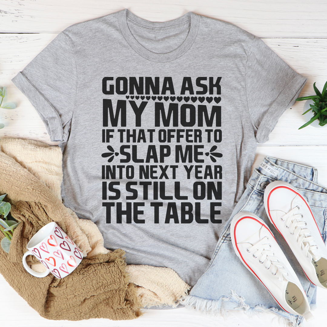 Gonna Ask My Mom T-Shirt displayed on a hanger, showcasing its soft cotton fabric and vibrant print.