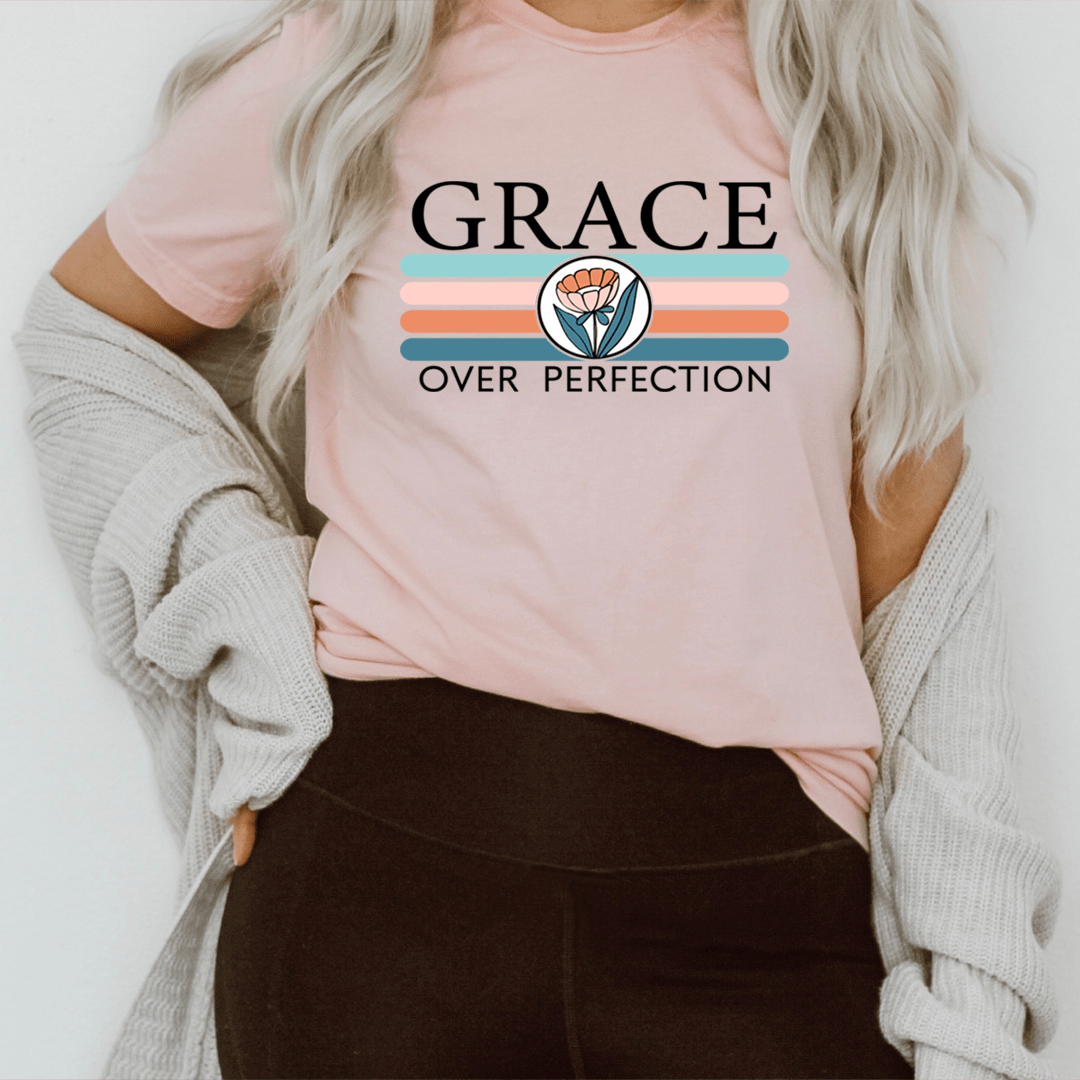 Grace Over Perfection T-Shirt displayed on a mannequin, showcasing its soft cotton fabric and durable stitching.