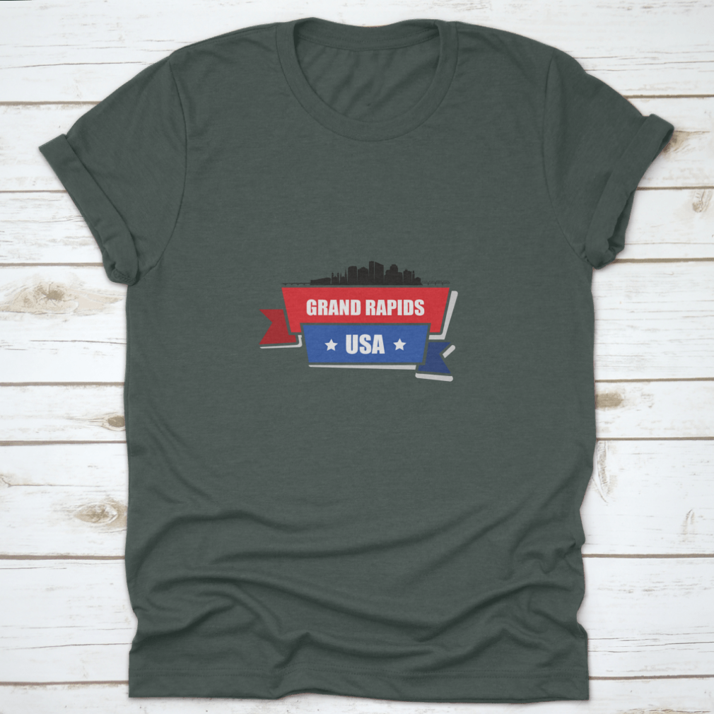 A stylish t-shirt featuring the Grand Rapids skyline design with red and blue ribbons, made from 100% cotton.