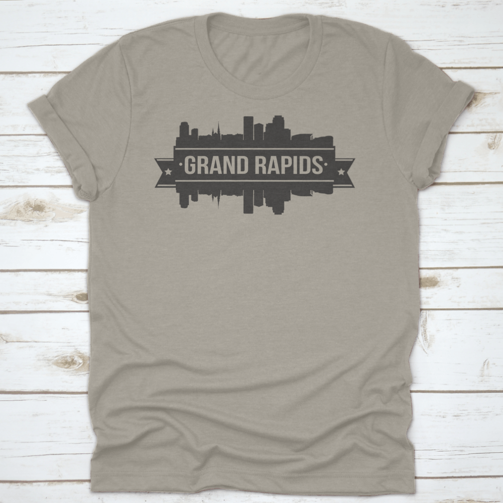 A stylish t-shirt featuring the Grand Rapids skyline silhouette design, showcasing the city's iconic buildings in a modern stamp style.