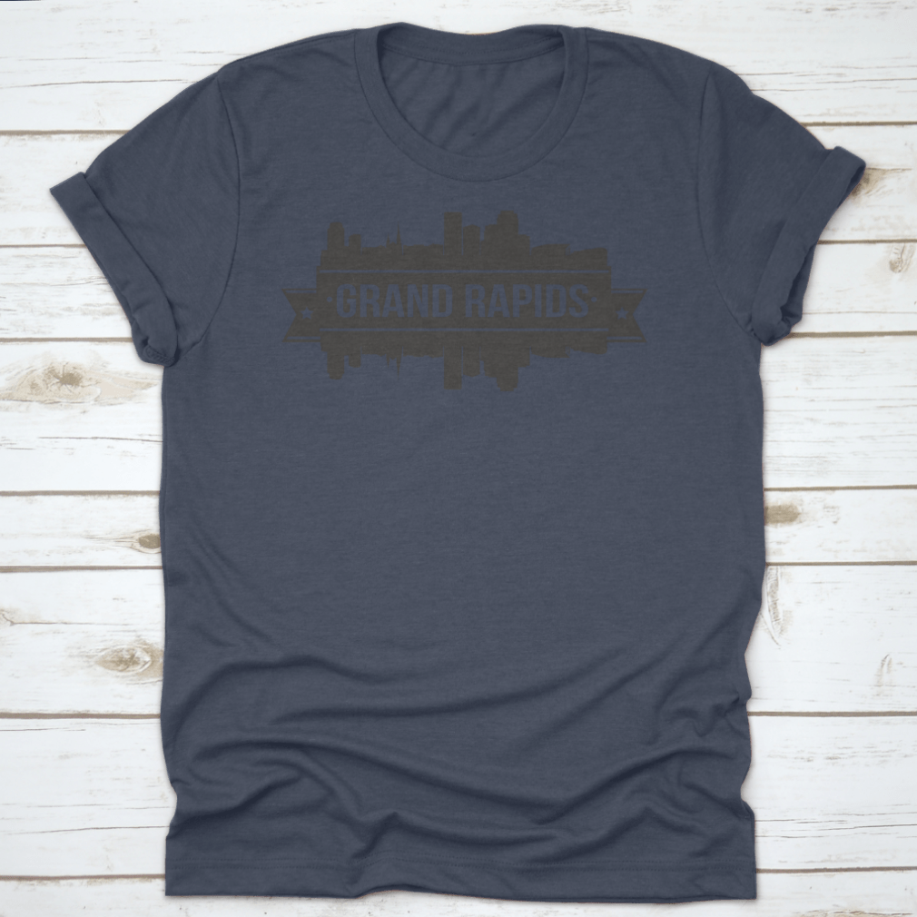 A stylish t-shirt featuring the Grand Rapids skyline silhouette design, showcasing the city's iconic buildings in a modern stamp style.