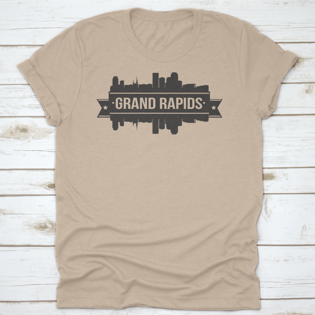 A stylish t-shirt featuring the Grand Rapids skyline silhouette design, showcasing the city's iconic buildings in a modern stamp style.