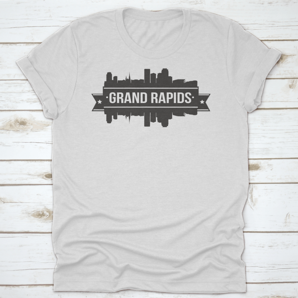 A stylish t-shirt featuring the Grand Rapids skyline silhouette design, showcasing the city's iconic buildings in a modern stamp style.