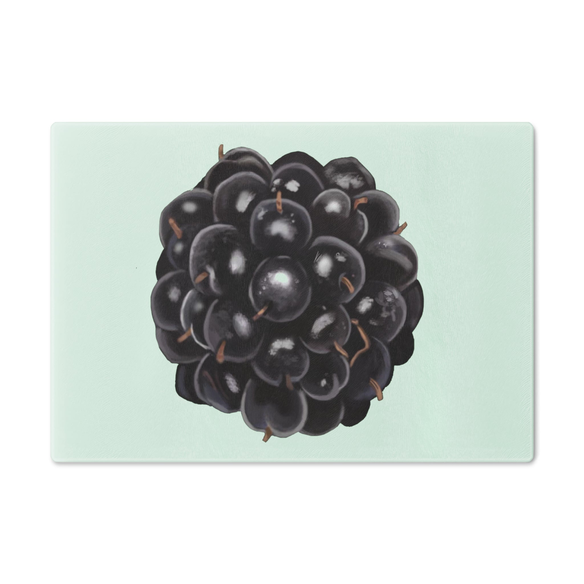 A stylish Grape Cutting Board made of tempered glass with a grape design, featuring four rubber dots for stability.