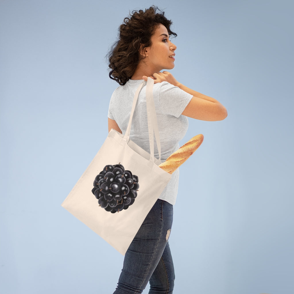 A stylish Grape Tote Bag made from 100% cotton, featuring long handles and cross stitching for durability, available in various colors.