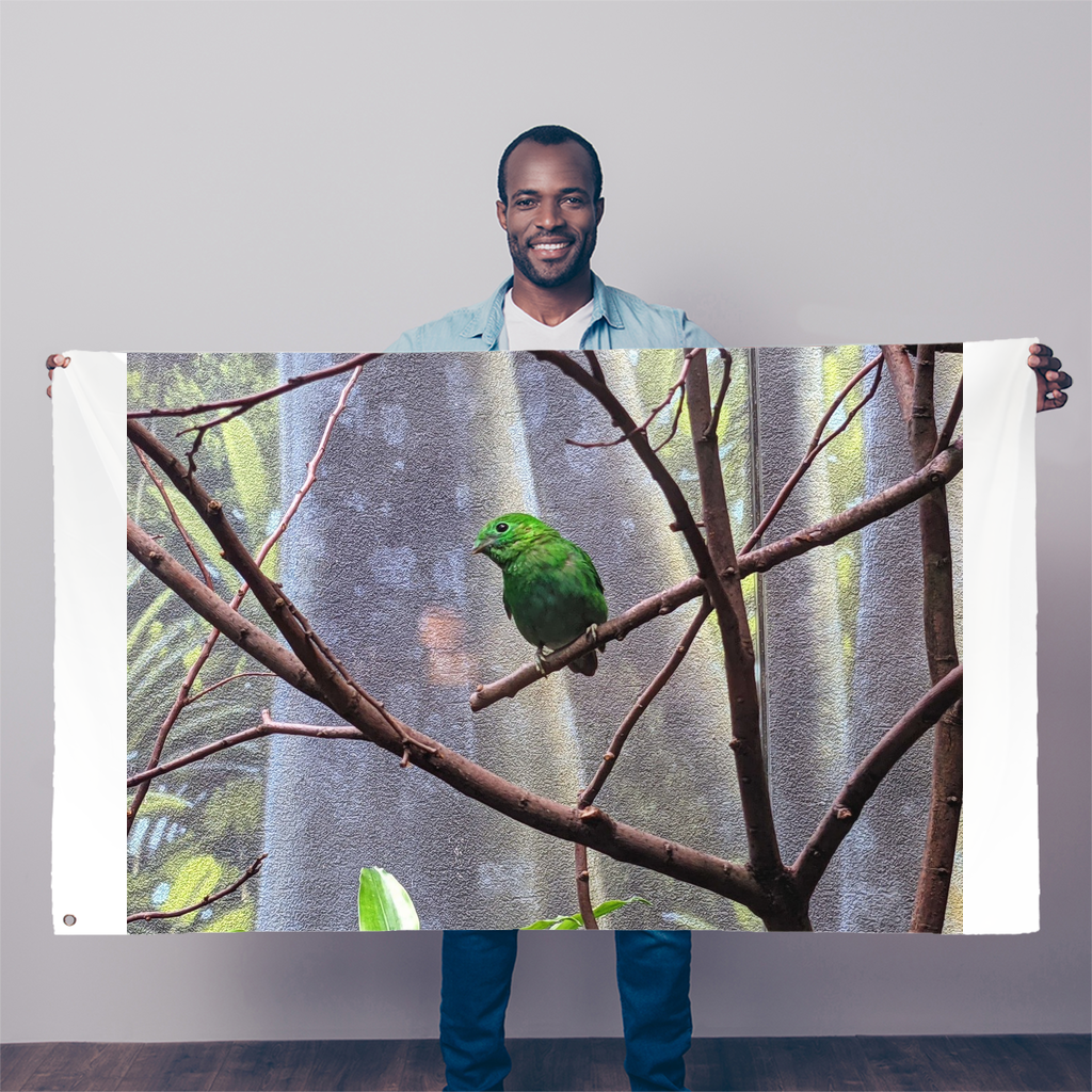 A vibrant Green Bird Sublimation Flag measuring 5FT x 3FT, made of durable polyester fabric with double-stitched edges and eyelets for hanging.