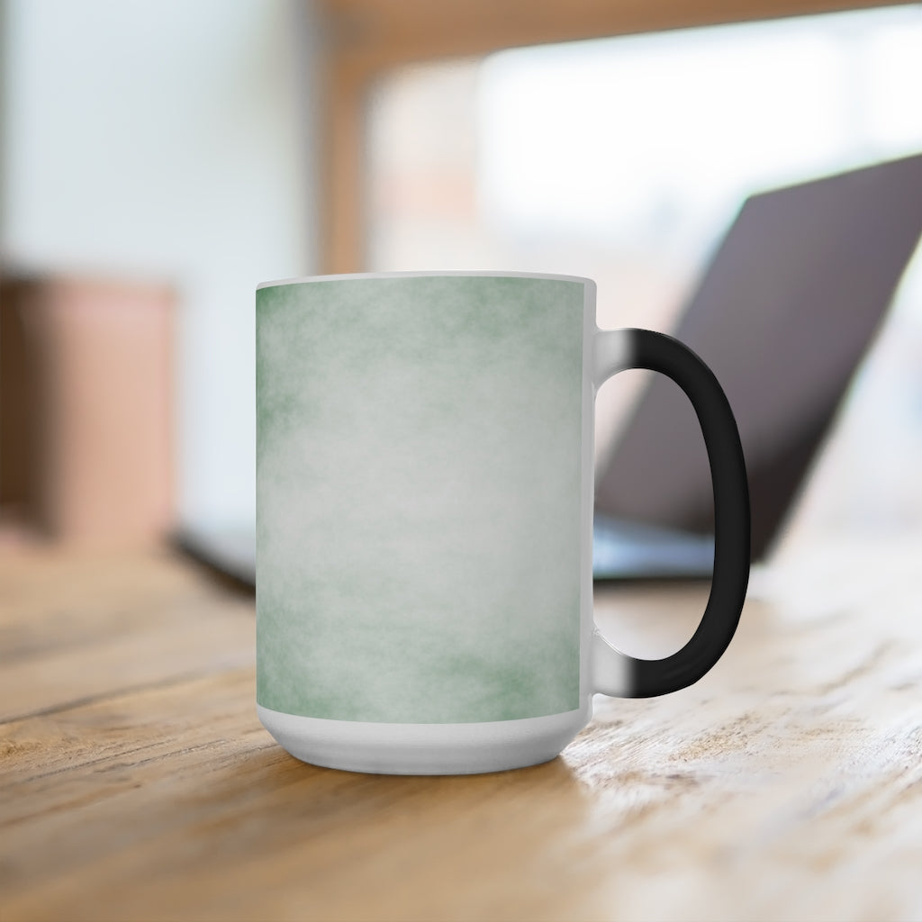 Green Clouds Color Changing Mug showcasing vibrant colors when filled with hot liquid, featuring a C-handle and rounded corners.