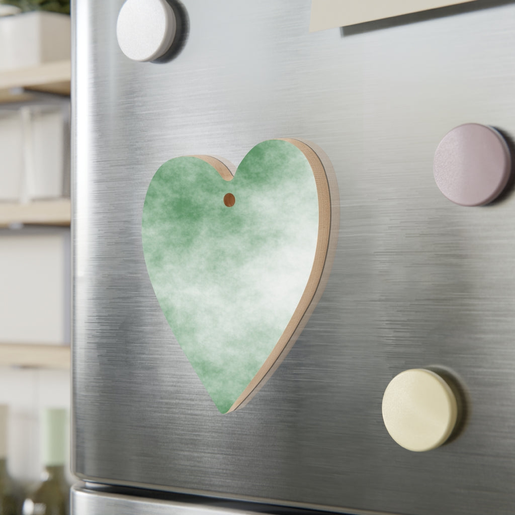 A collection of Green Clouds Wooden Christmas Ornaments in various whimsical shapes, featuring a rustic wood finish and red ribbons for hanging.