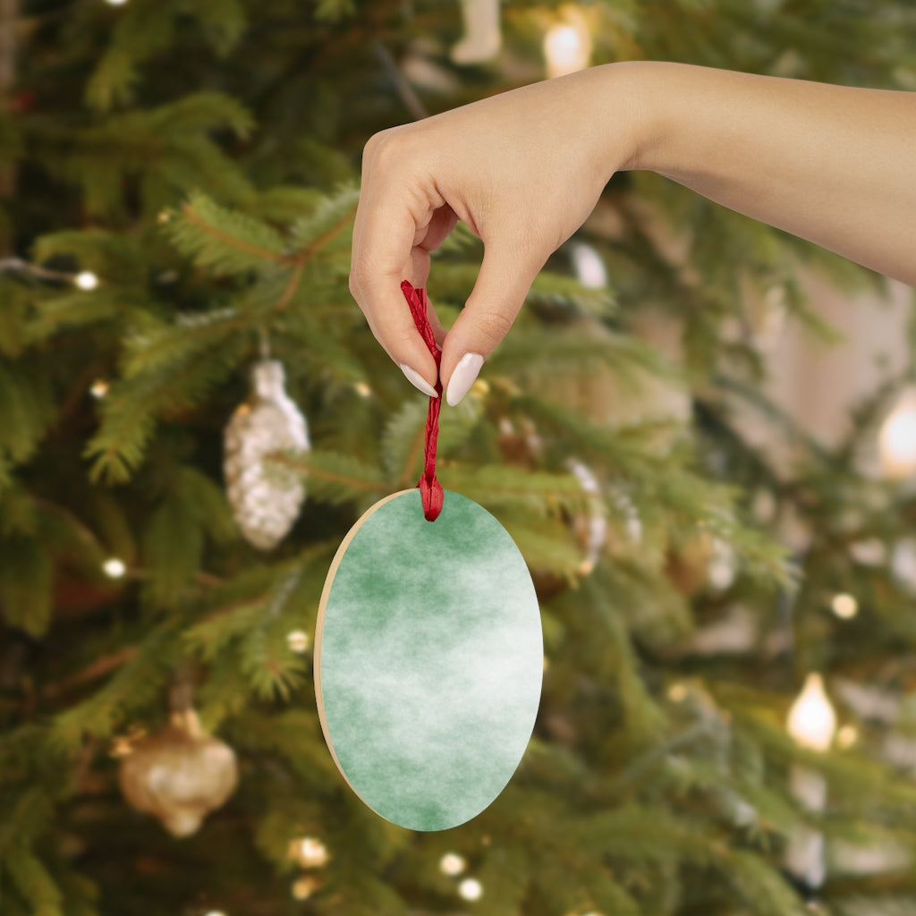 A collection of Green Clouds Wooden Christmas Ornaments in various whimsical shapes, featuring a rustic wood finish and red ribbons for hanging.