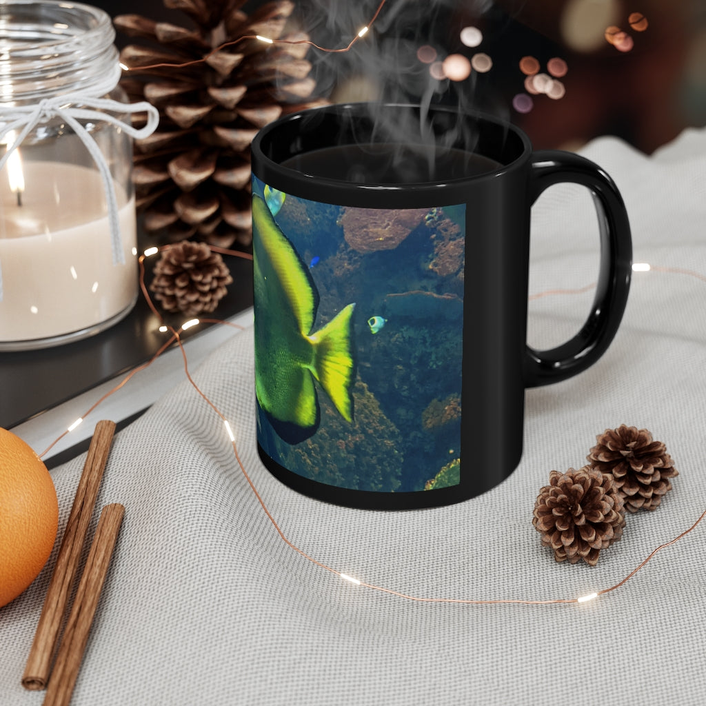 Green Fish 11oz black ceramic mug with a C-handle, perfect for coffee, tea, or hot chocolate.