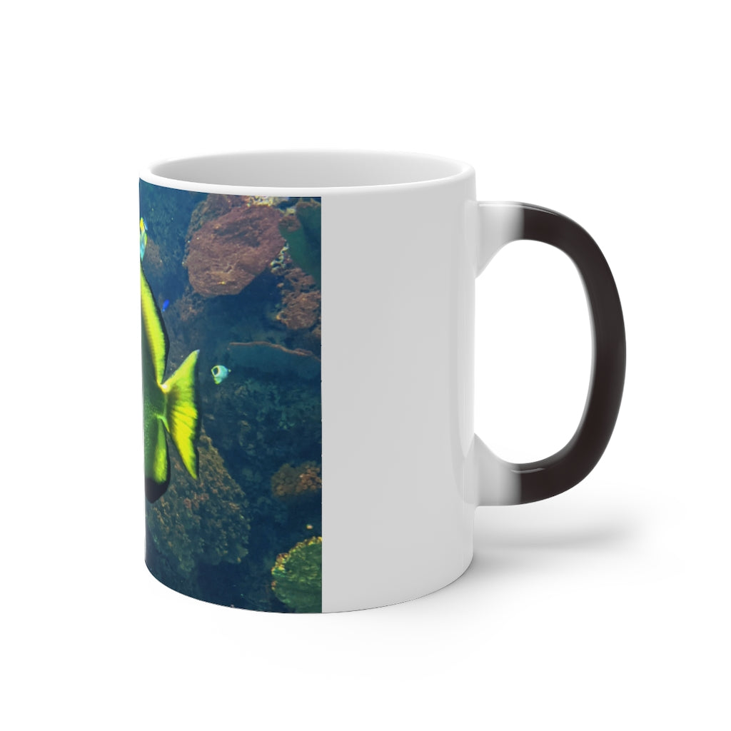 Green Fish Color Changing Mug showcasing its vibrant color transformation when filled with hot liquid.