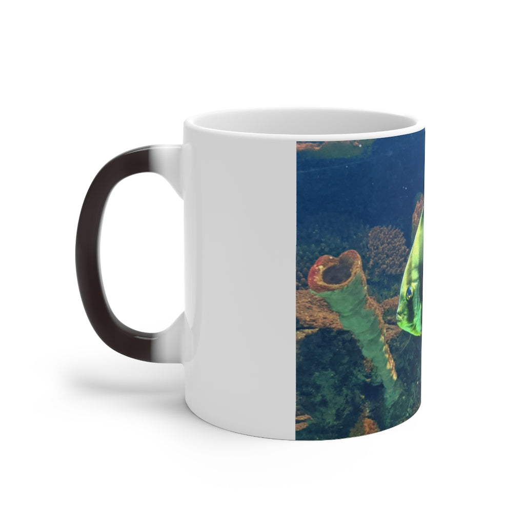 Green Fish Color Changing Mug showcasing its vibrant color transformation when filled with hot liquid.