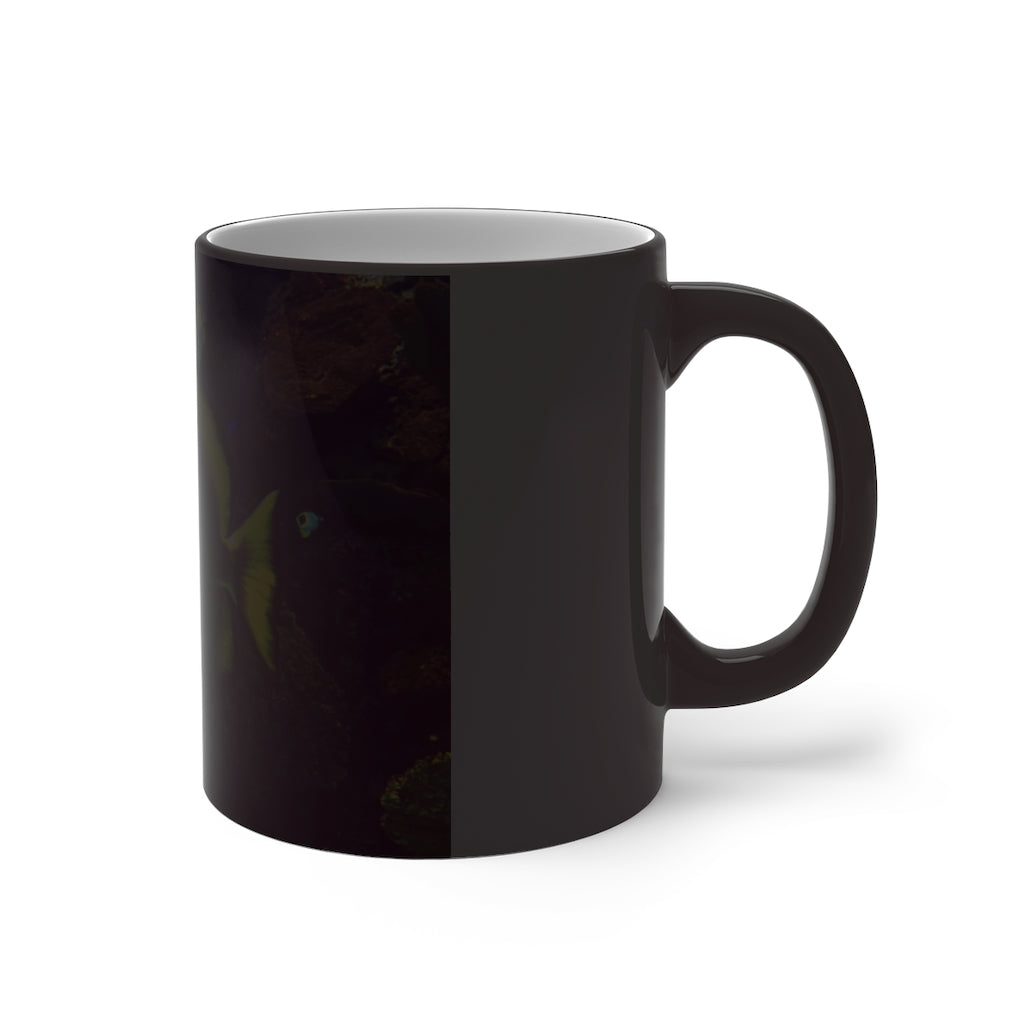 Green Fish Color Changing Mug showcasing its vibrant color transformation when filled with hot liquid.