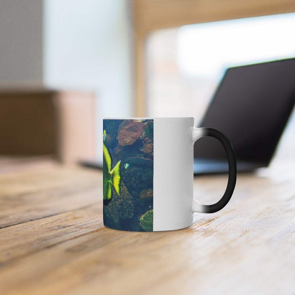 Green Fish Color Changing Mug showcasing its vibrant color transformation when filled with hot liquid.