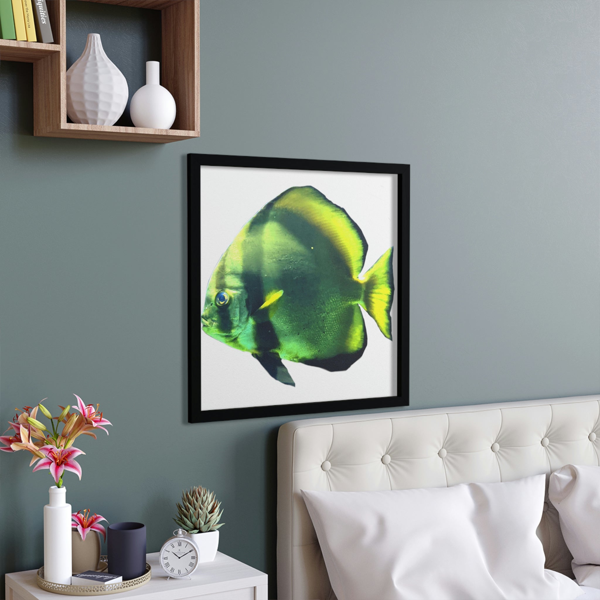 A beautifully framed poster featuring a green fish design, showcasing a hand-crafted wooden frame and vibrant colors.