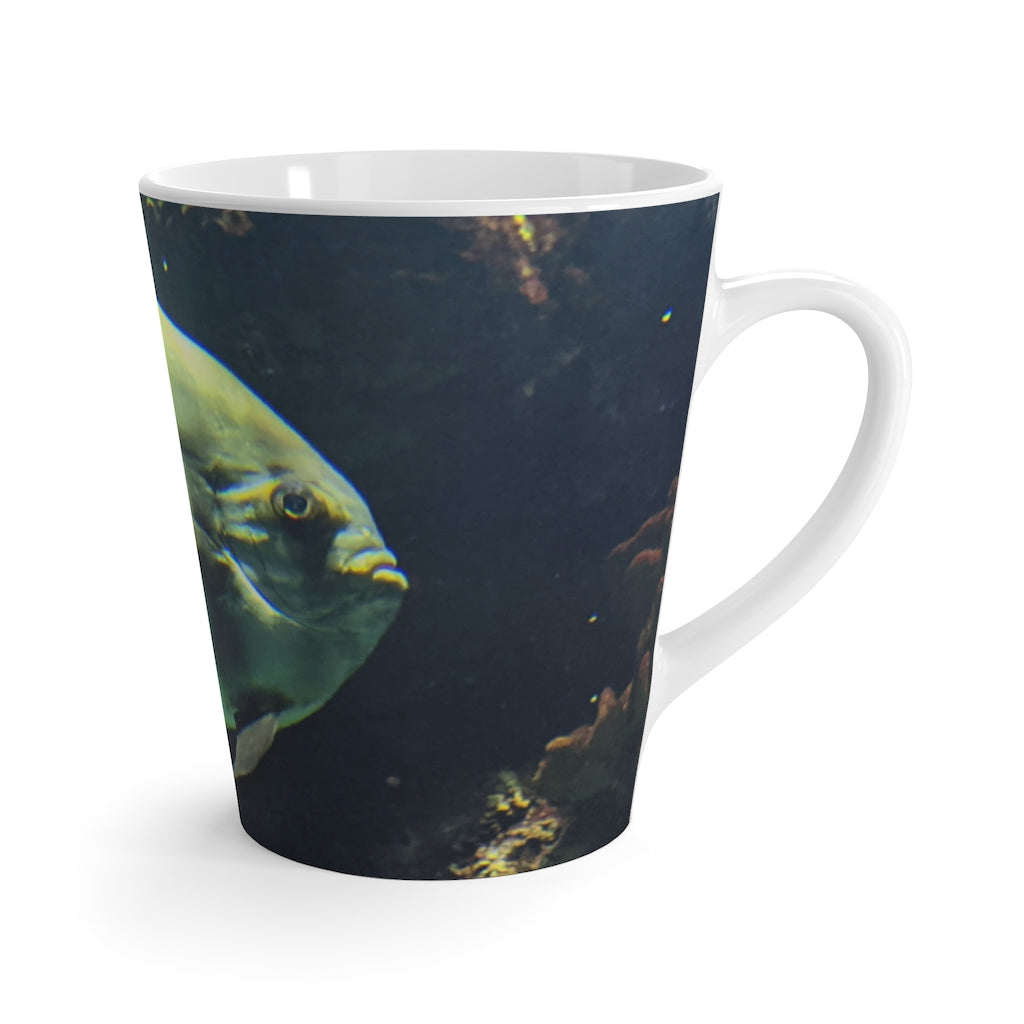 A stylish green fish latte mug made of durable ceramic, featuring a unique design and comfortable C-handle.