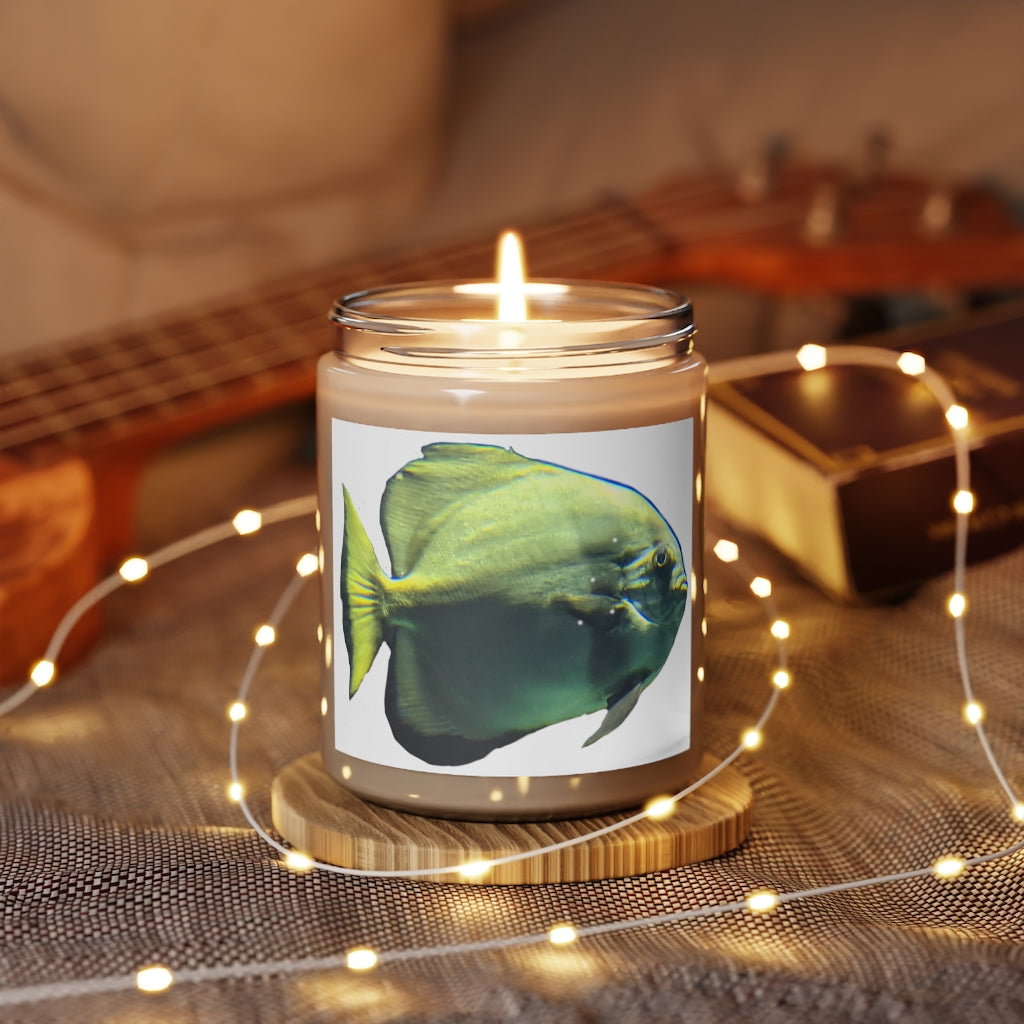 Green Fish Scented Candle in a glass container, showcasing its elegant design and soothing aroma.