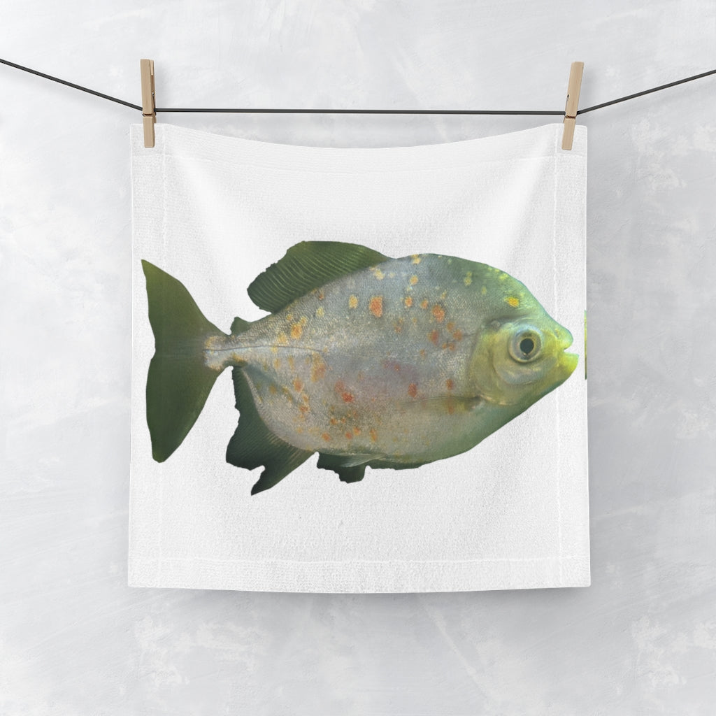 A vibrant green face towel featuring a whimsical fish with glasses, made from a soft polyester blend front and absorbent cotton back.