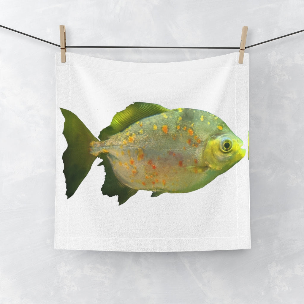 A vibrant green face towel featuring a whimsical fish with glasses design, made from a soft polyester blend front and absorbent cotton back.