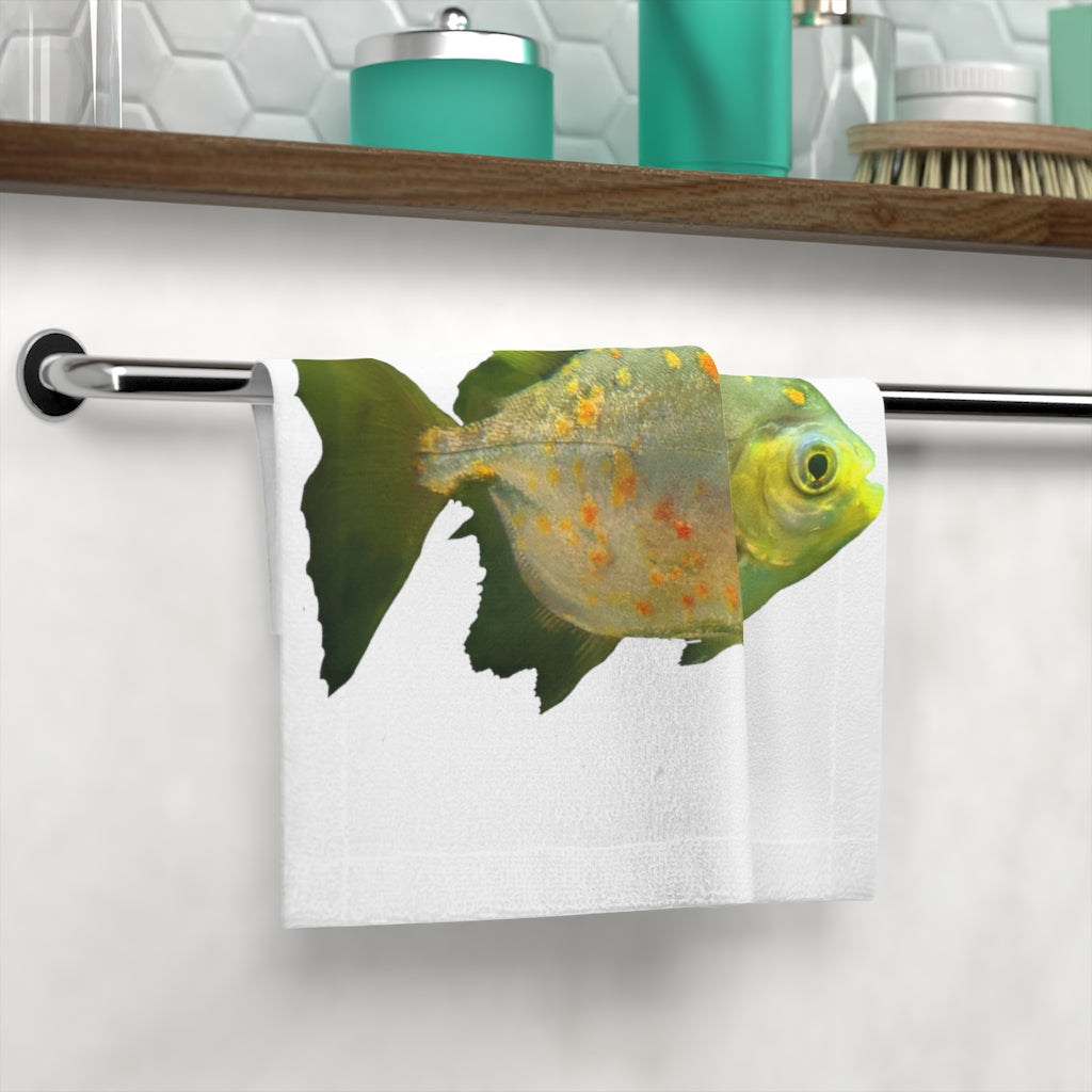 A vibrant green face towel featuring a whimsical fish with glasses design, made from a soft polyester blend front and absorbent cotton back.