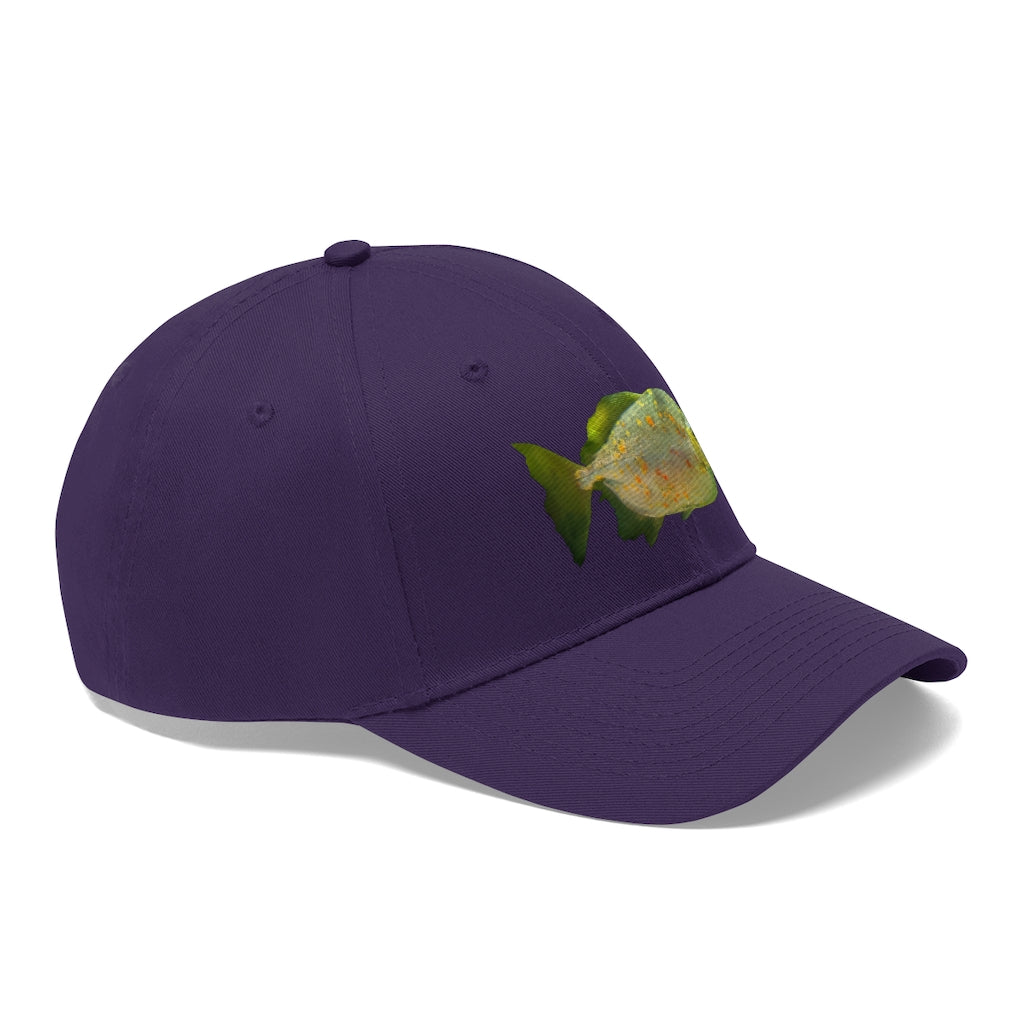 Green Fish with Specs Unisex Twill Hat featuring a playful fish graphic, made of 100% cotton twill with an adjustable Velcro closure.