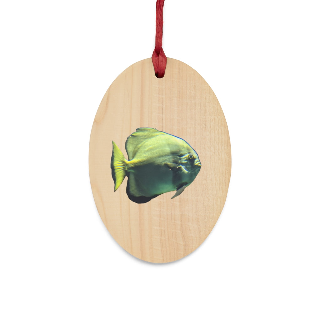 A collection of Green Fish Wooden Christmas Ornaments in various whimsical shapes, featuring a rustic wood finish and red ribbons for hanging.