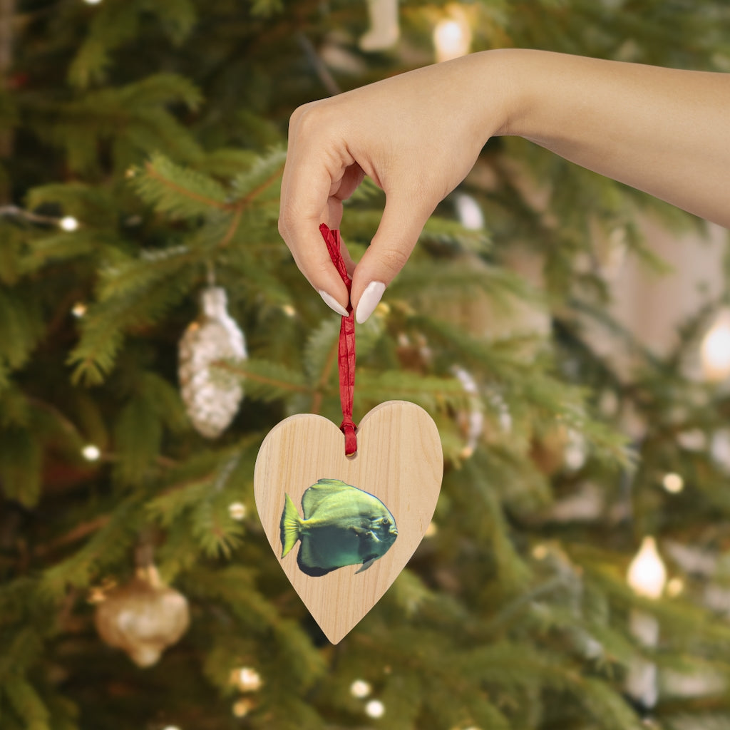 A collection of Green Fish Wooden Christmas Ornaments in various whimsical shapes, featuring a rustic wood finish and red ribbons for hanging.