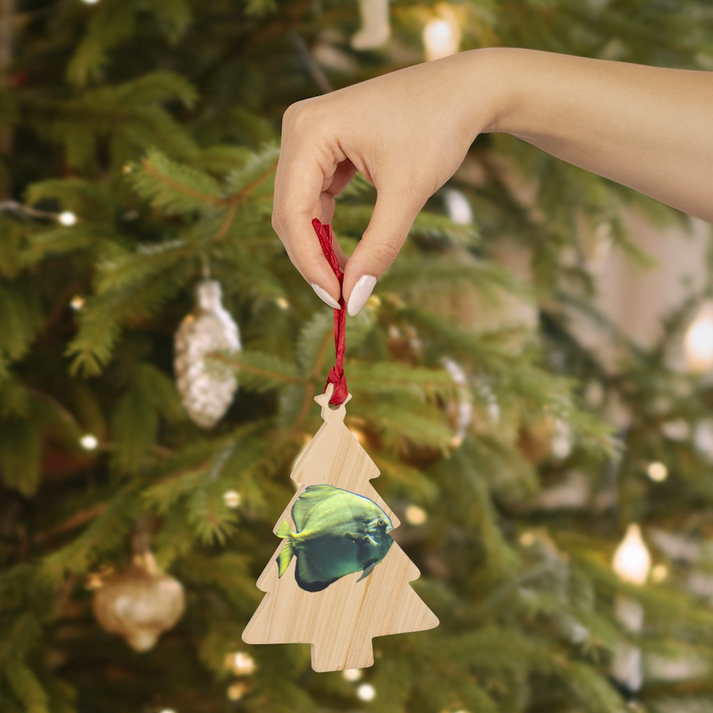 A collection of Green Fish Wooden Christmas Ornaments in various whimsical shapes, featuring a rustic wood finish and red ribbons for hanging.