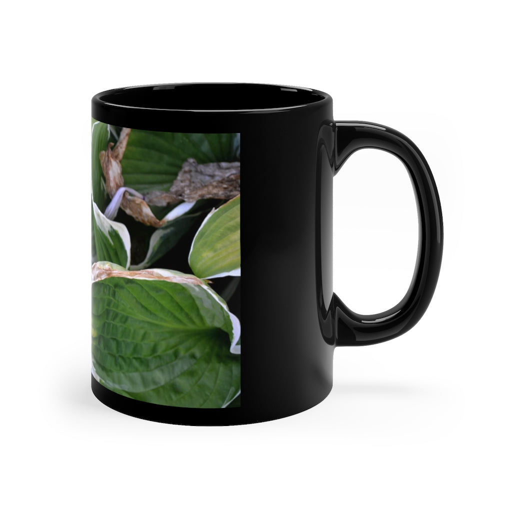 Green Leaves 11oz black ceramic mug with a C-handle, perfect for coffee, tea, or hot chocolate.