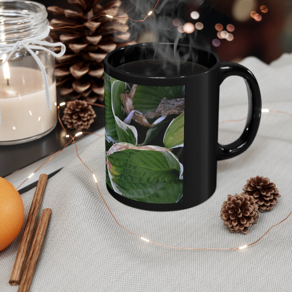 Green Leaves 11oz black ceramic mug with a C-handle, perfect for coffee, tea, or hot chocolate.