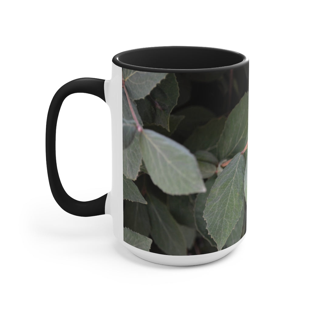 A stylish Green Leaves Accent Mug featuring a white exterior with a colored interior, showcasing a beautiful green leaves design.