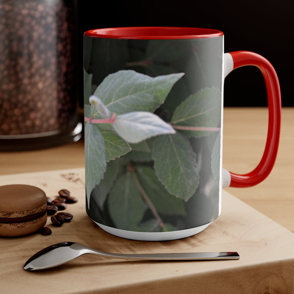 A stylish Green Leaves Accent Mug featuring a white exterior with a colored interior, showcasing a beautiful green leaves design.