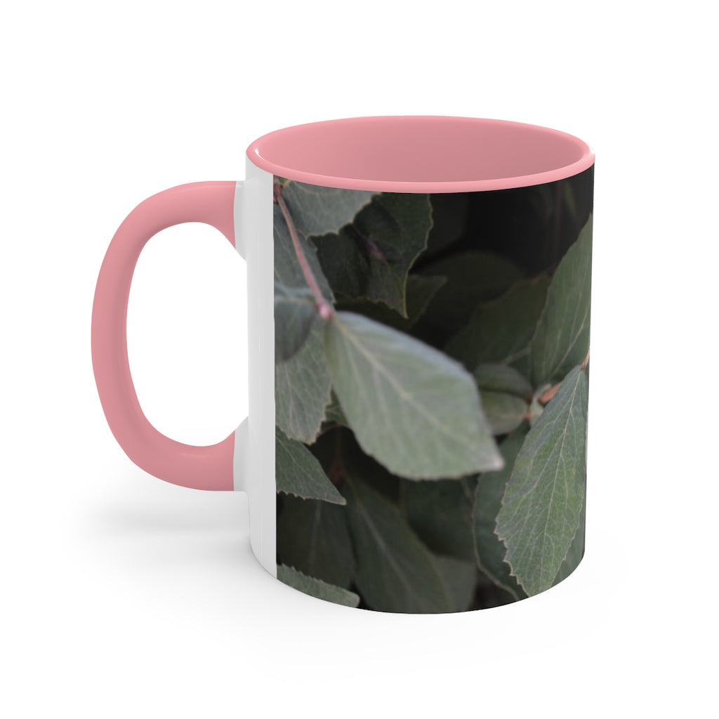 A stylish Green Leaves Accent Mug featuring a white exterior with a colored interior, showcasing a beautiful green leaves design.